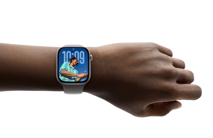 A person wears Apple Watch Series 11 with Photos watch face