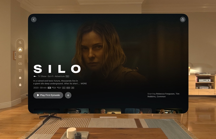 The Apple TV experience of Apple Vision Pro is displayed in a living room, with a still image from the Apple TV+ series Chief of War