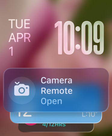 Remote Camera widget appears at bottom of screen, translucent time numerals top right, date top left