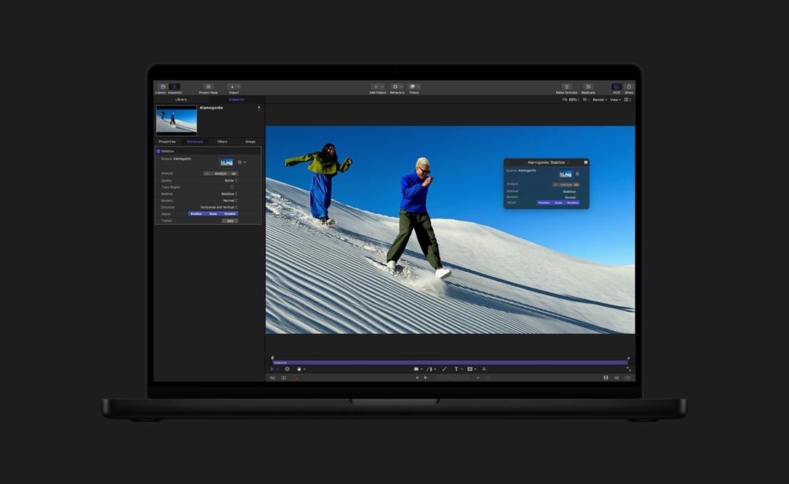 MacBook Pro 16, couple running down sand dune, demo of image stabilization